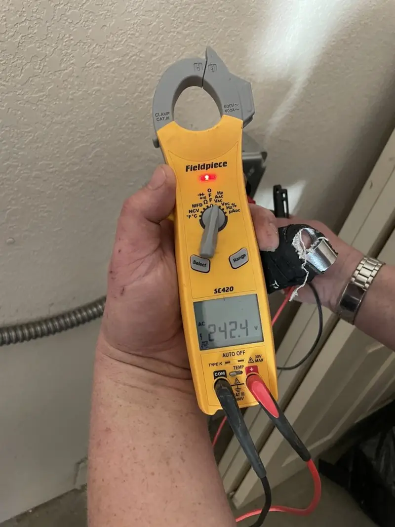 Voltage testing with clamp meter during Whole House Surge Protector in Coshocton